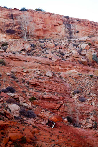 Car over Cliff edge along Comb Ridge Dugway